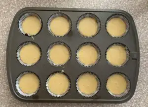 cupcake tins filled with vanilla cake batter
